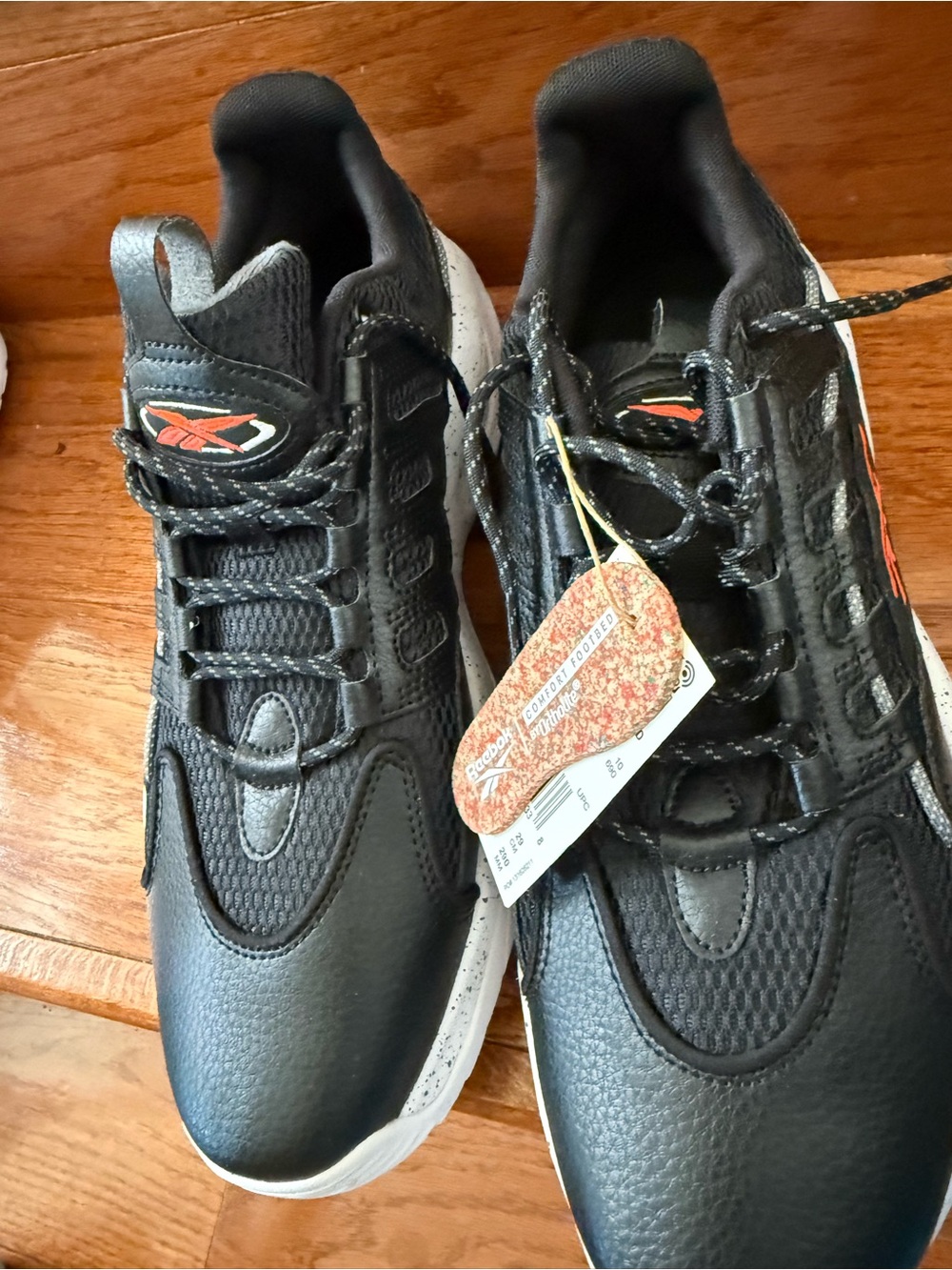Reebok Men's Black Athletic Sneakers with Orange Logo Accent
